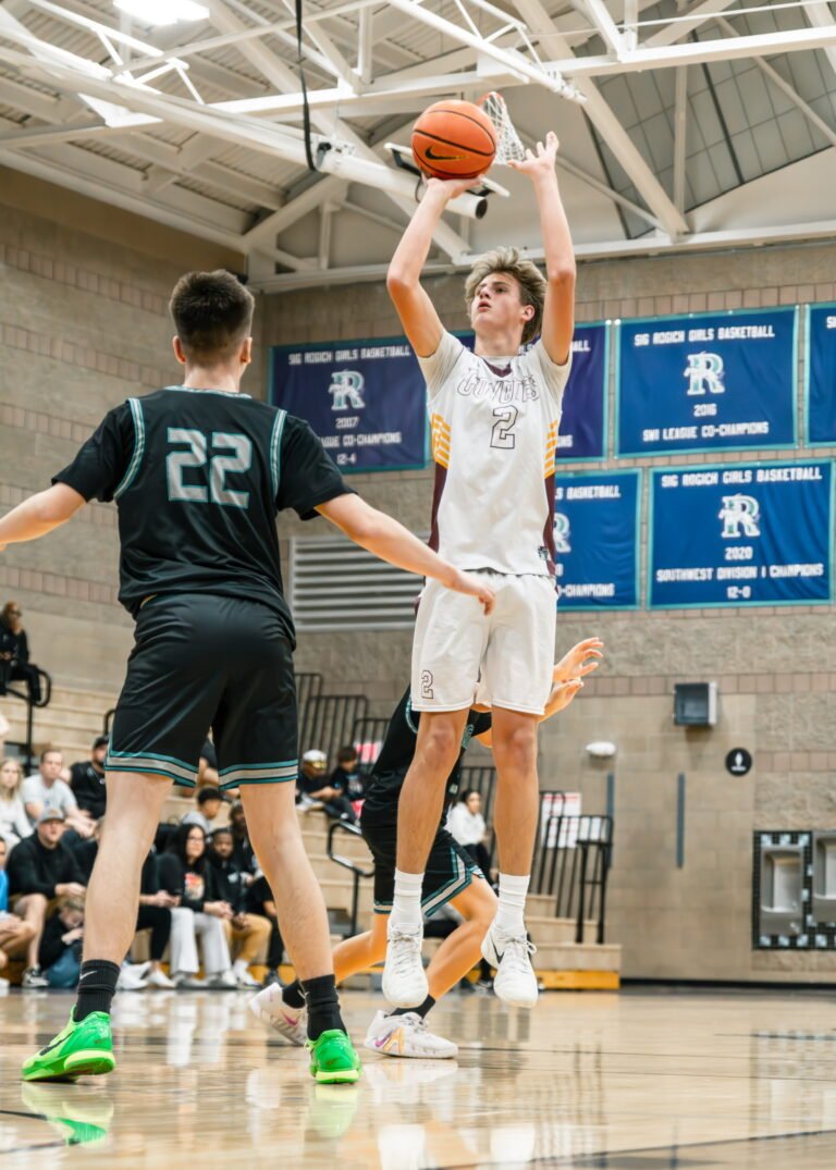 Cooper taking a jump shot during a basketball game